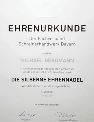 Darstellung der Ehrenurkunde die silberne Ehrennadel 